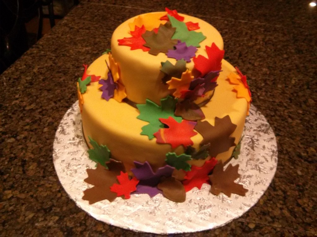 Colorful fondant cake with fall leaves.